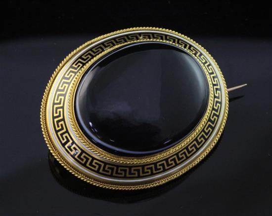 A Victorian gold, enamel and banded agate set mourning brooch, 1.75in.